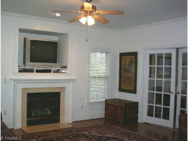 1806 Ridge Oaks Drive Oak Ridge, NC 27310 - Photo 3 of 9 Other. Great room has a fireplace, TV nook, and french doors leading to the formal living room.