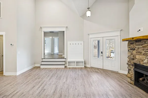 a view of a kitchen with dining room and wooden floor