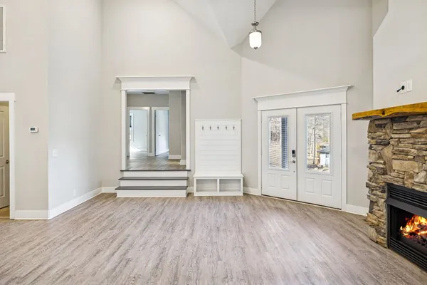 a view of a kitchen with dining room and wooden floor