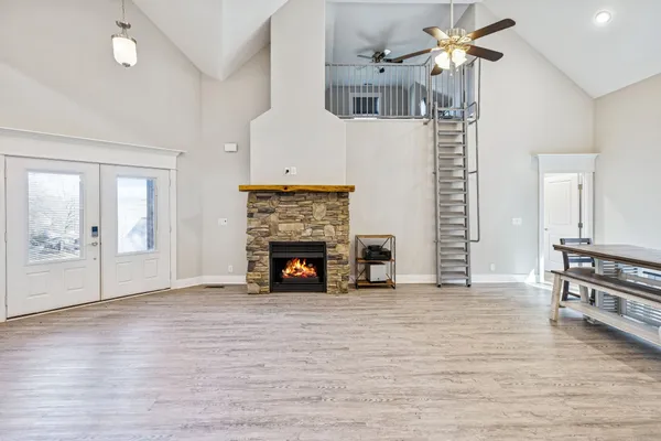 a bathroom with a tub sink and mirror