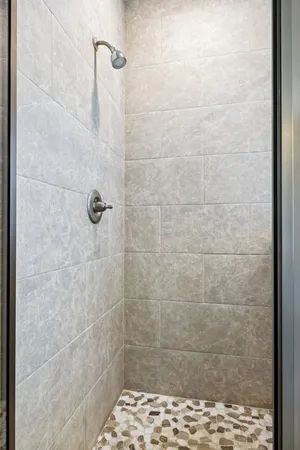 a bathroom with a double vanity sink toilet mirror and bathtub