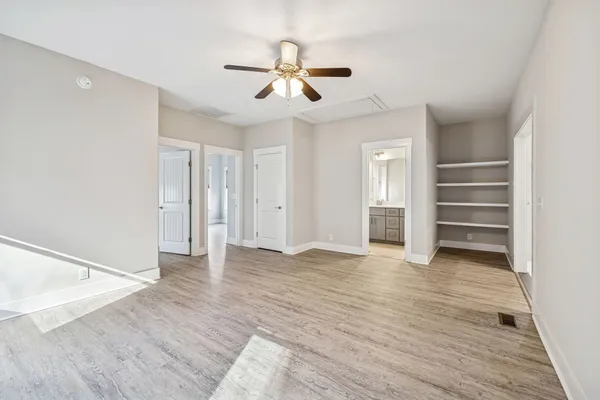 an empty room with wooden floor