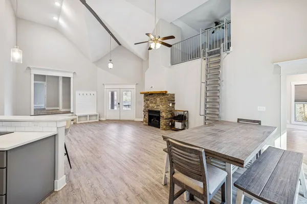 wooden floor in an empty room with a fireplace