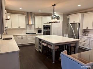 2500 Walnut View Drive Howell, MI 48855 - Photo 10 of 41 Kitchen featuring a kitchen island, white cabinetry, recessed lighting, appliances with stainless steel finishes, and light countertops