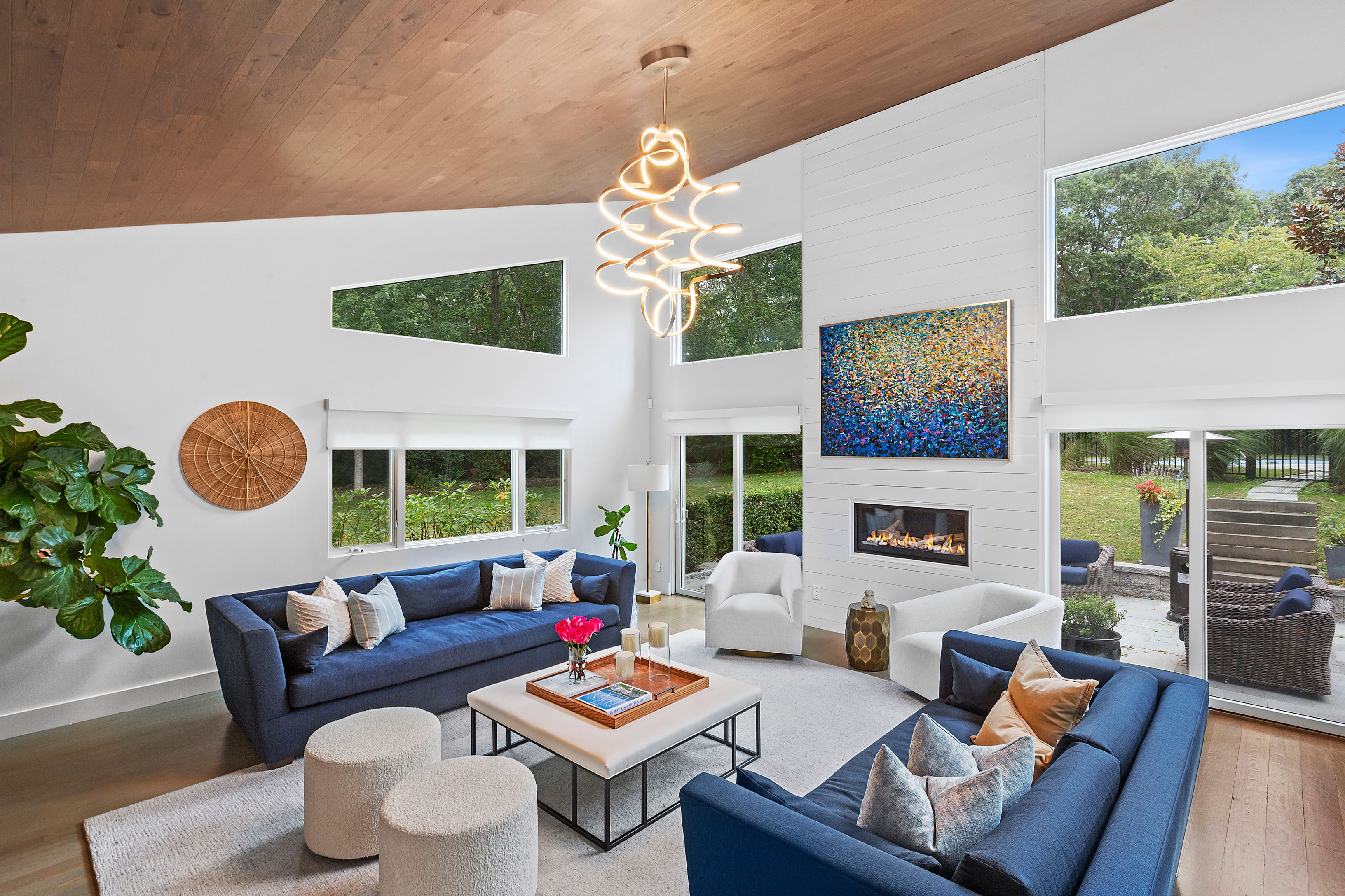 81 Neck Path East Hampton, NY 11937 - Photo 1 of 29 a living room with furniture a chandelier and a fireplace