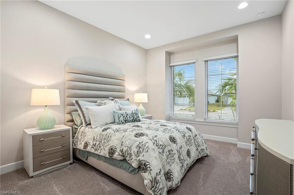 8795 Calypso Court Naples, FL 34113 - Photo 17 of 49 a bedroom with a bed and a window
