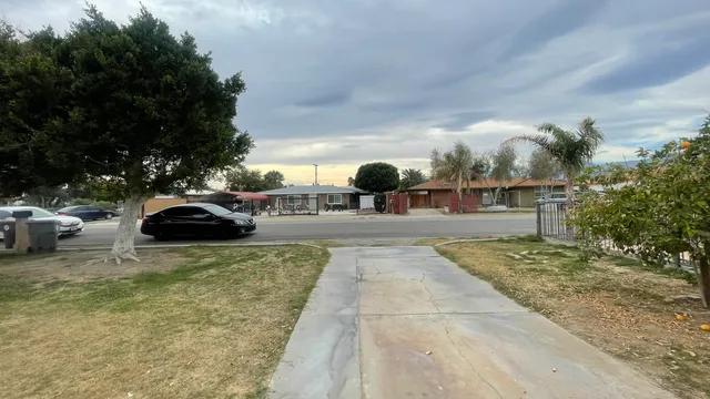 a view of outdoor space with swimming pool and furniture