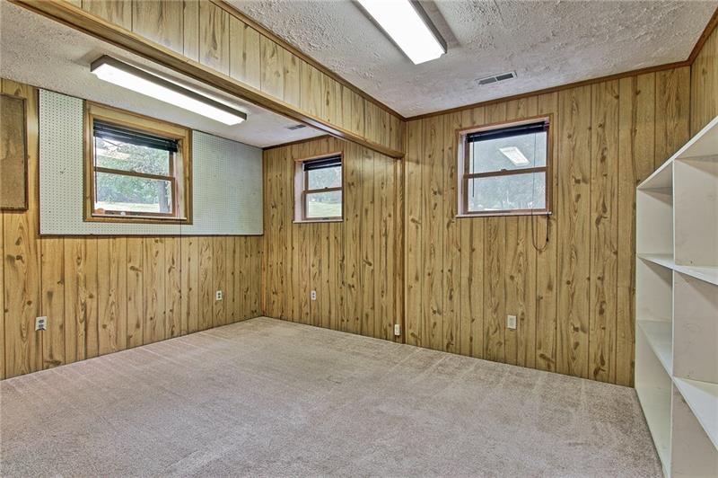 112 Wycliffe Way Butler, PA 16001 - Photo 18 of 24 More space! Is this your den or craft room or playroom or gym or throw all your junk in it and close the door room? Better yet, turn it into the 4th bedroom. Put some bunk beds in there and you'll be all set when the Brady Bunch shows up! This room is in front of the house under the living room.