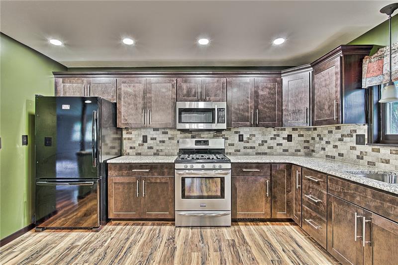 112 Wycliffe Way Butler, PA 16001 - Photo 3 of 24 Check out this awesome new totally renovated kitchen. New floors, stainless appliances, granite countertop, tile back splash, Wolf cabinetry (based in York PA!), spacious pantry, double stainless sink.