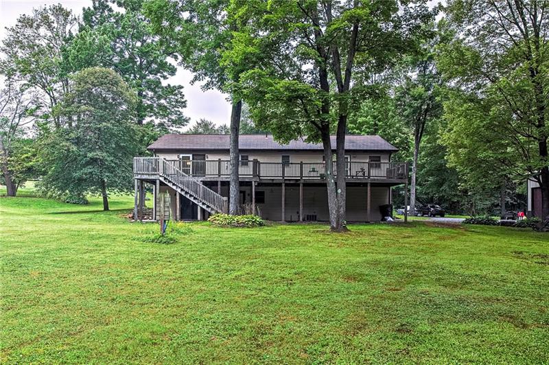 112 Wycliffe Way Butler, PA 16001 - Photo 21 of 24 View from way back in the back yard. A few more trees, then its wide-open space for the kids and pets...or anyone else you want to get out of your hair so you can chill for just a few minutes!