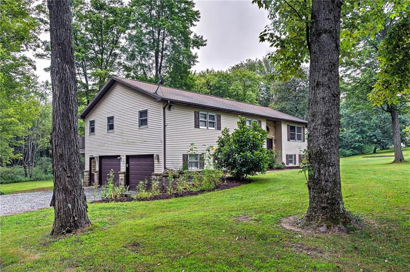 112 Wycliffe Way Butler, PA 16001 - Photo 22 of 24 2 car garage with room for storage or workbenches. Several beautiful mature trees flank the house. No one wants immature trees. They whine too much.