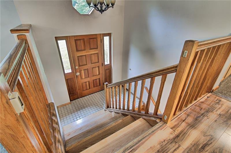 112 Wycliffe Way Butler, PA 16001 - Photo 10 of 24 Main Entry with wood steps and oak railing. Tile floor.