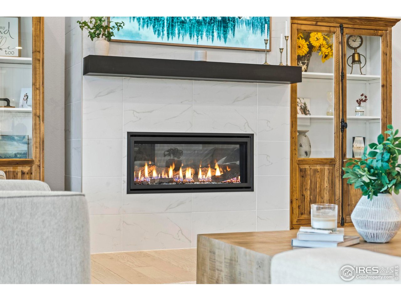 4344 Shivaree Court Timnath, CO 80547 - Photo 14 of 41 A beautifully designed living room with a cozy gas fireplace