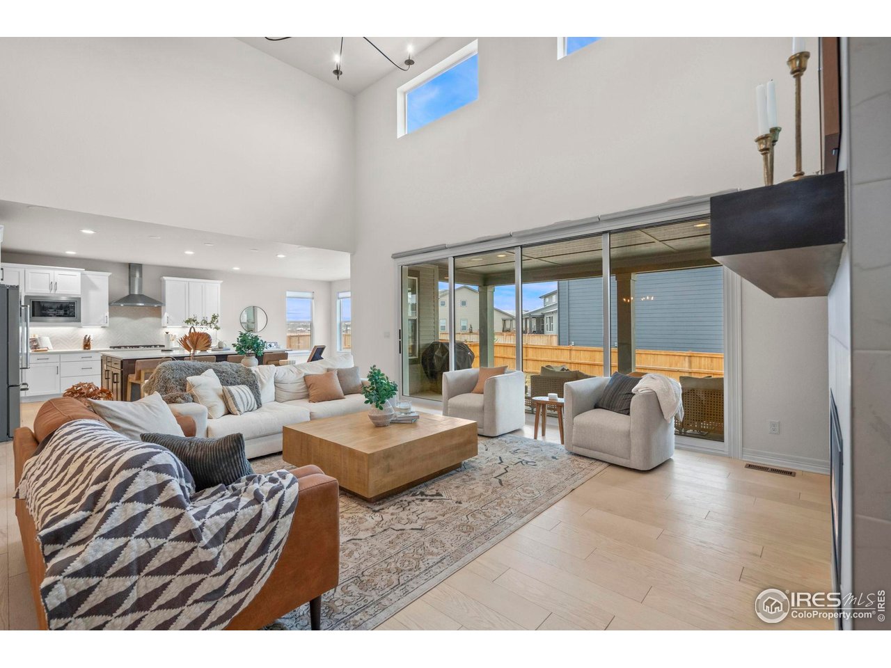 4344 Shivaree Court Timnath, CO 80547 - Photo 15 of 41 Open-concept living seamlessly connects the kitchen, dining and living areas.