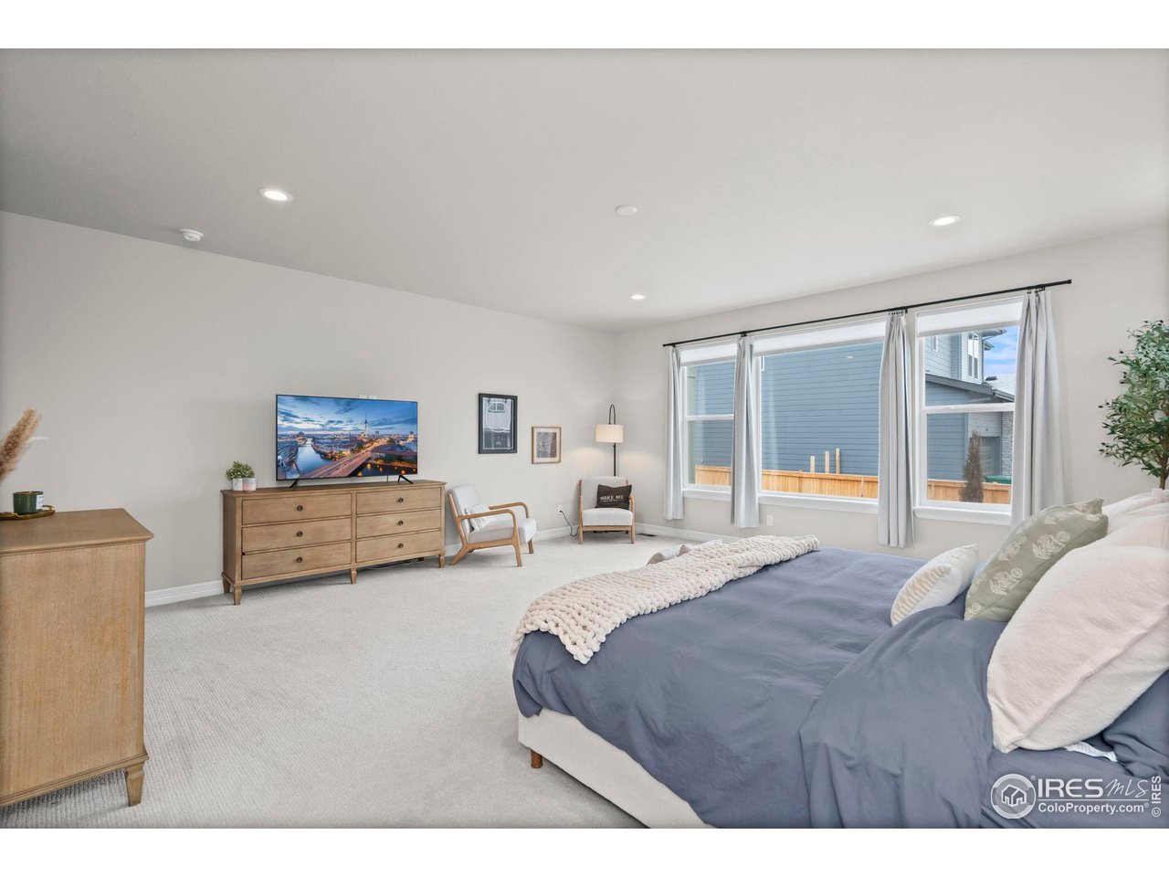 4344 Shivaree Court Timnath, CO 80547 - Photo 21 of 41 Abundant natural light in spacious primary suite.