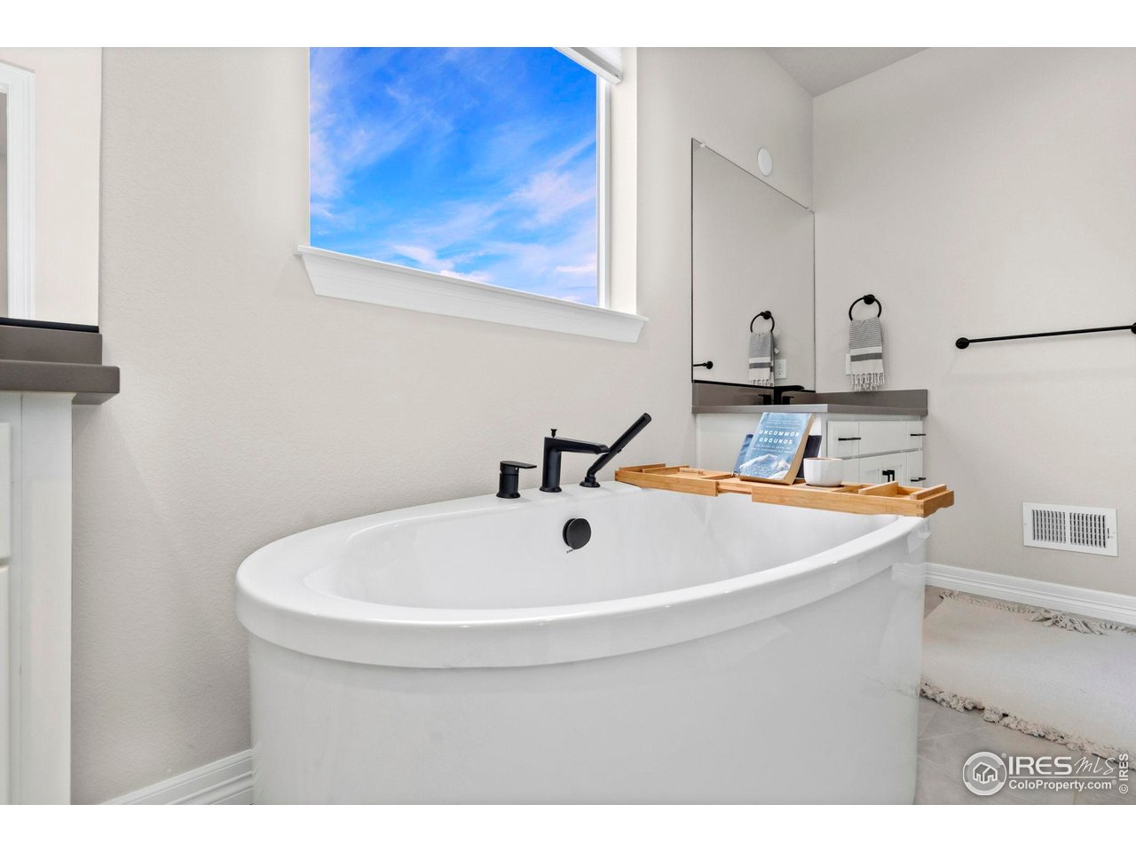 4344 Shivaree Court Timnath, CO 80547 - Photo 22 of 41 Relaxing primary bath with a deep soaking tub!