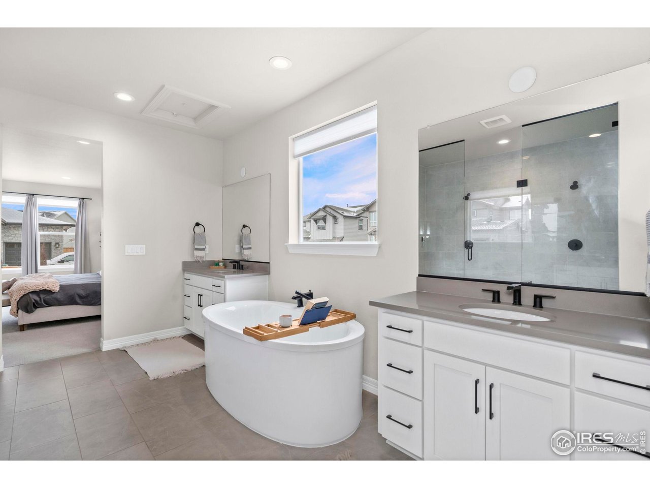 4344 Shivaree Court Timnath, CO 80547 - Photo 23 of 41 Primary Bathroom with soaking tub and oversized shower.