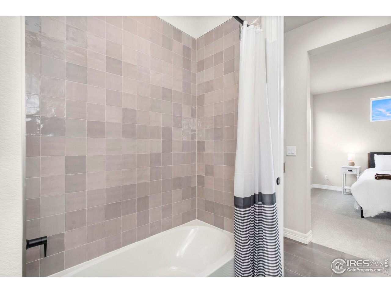 4344 Shivaree Court Timnath, CO 80547 - Photo 34 of 41 Jack and Jill bathroom shared between bedroom #3 and #4 featuring dual sinks and modern finishes