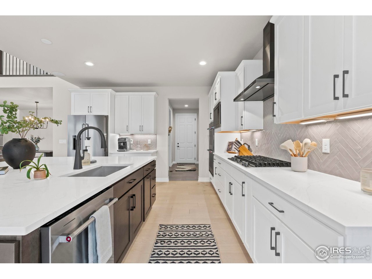 4344 Shivaree Court Timnath, CO 80547 - Photo 9 of 41 Chef's kitchen equipped with premium KitchenAid Appliances