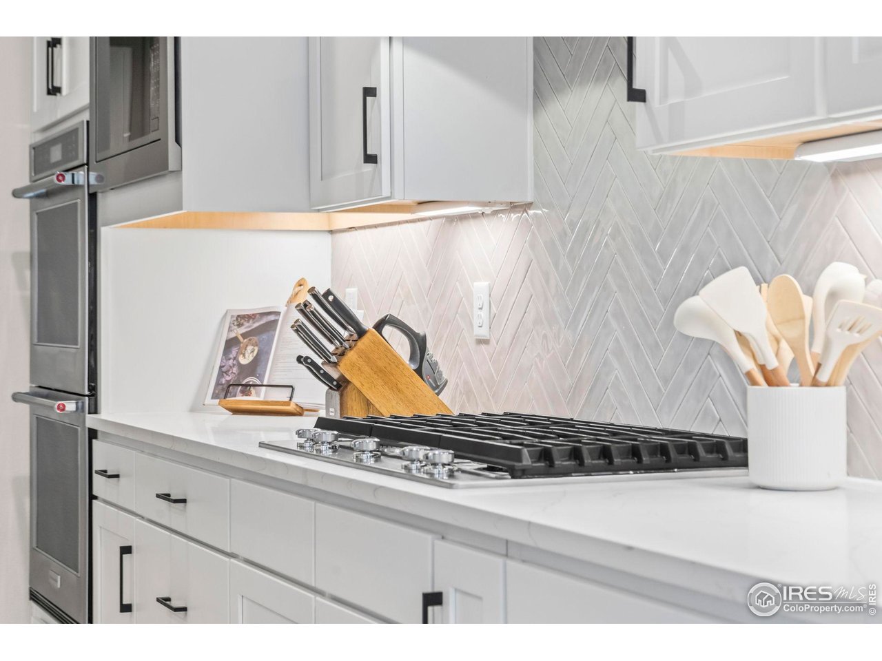 4344 Shivaree Court Timnath, CO 80547 - Photo 10 of 41 Gas stovetop with abundant counter space