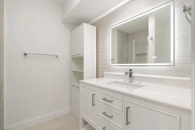 a bathroom with a sink and a mirror
