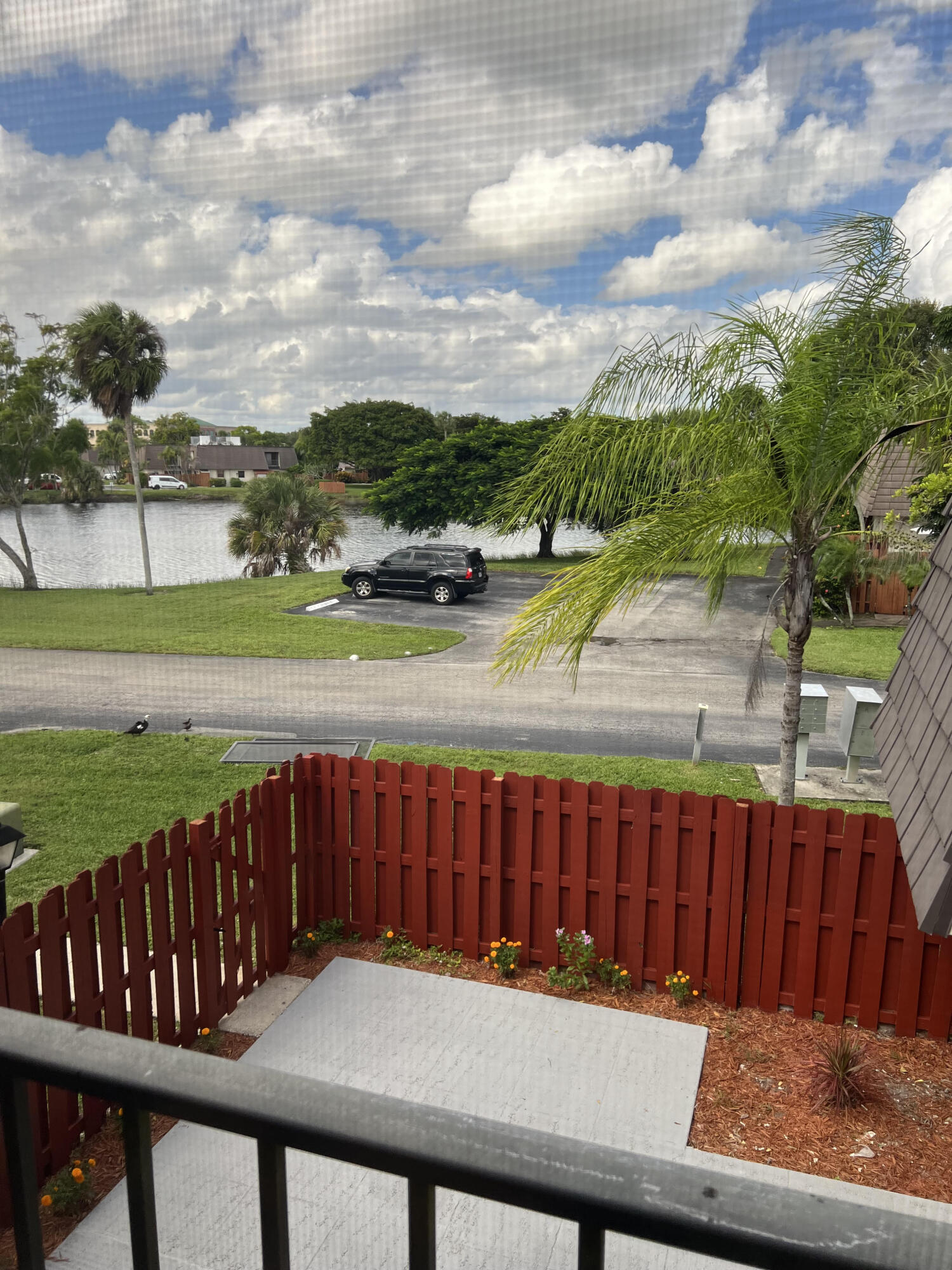 326 Jupiter Lakes Boulevard, Unit 2310B Jupiter, FL 33458 - Photo 34 of 48 a view of a wooden deck with city view