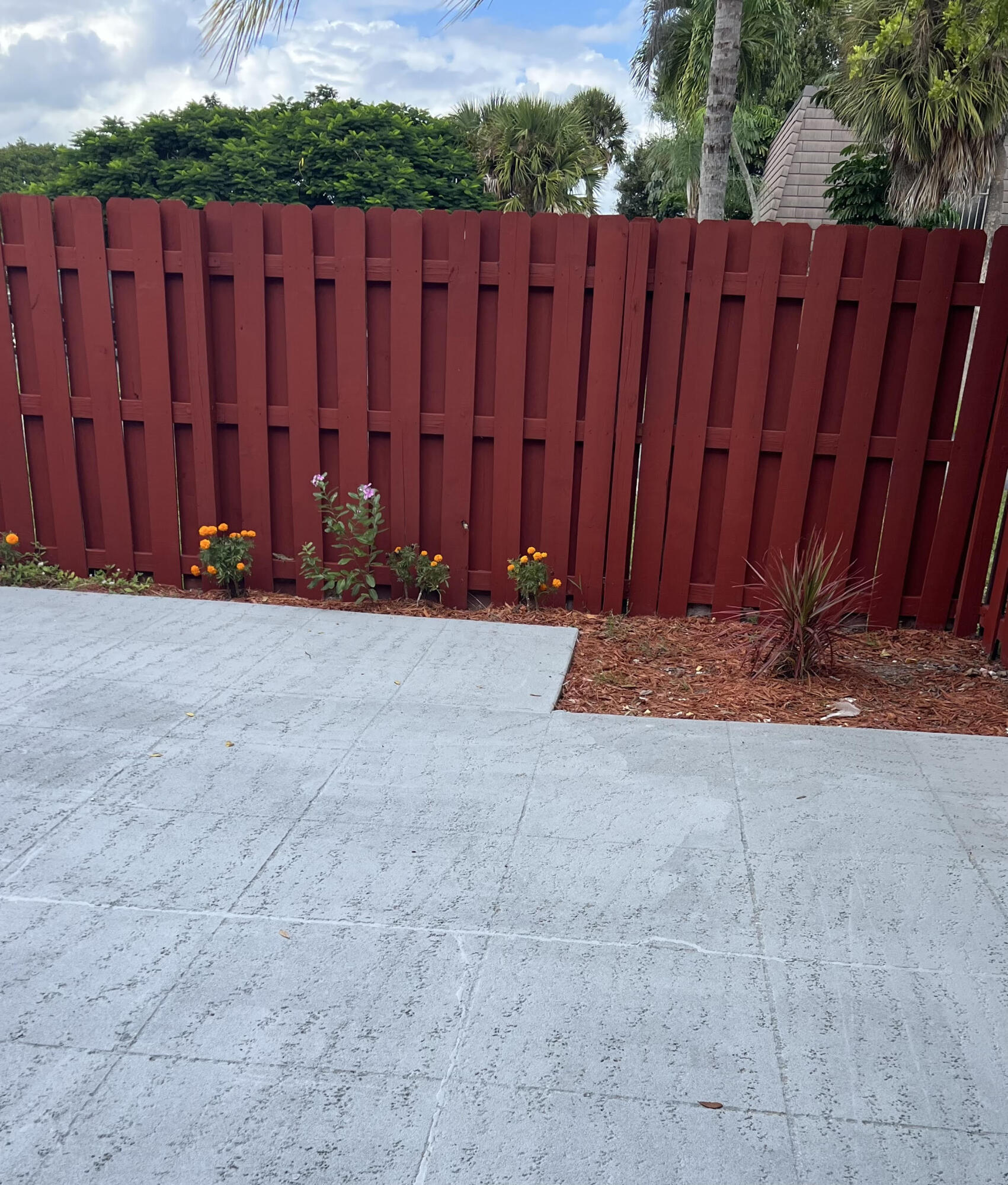326 Jupiter Lakes Boulevard, Unit 2310B Jupiter, FL 33458 - Photo 37 of 48 a view of wooden fence with a wooden fence