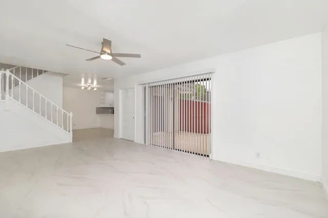 a view of a livingroom with a ceiling fan