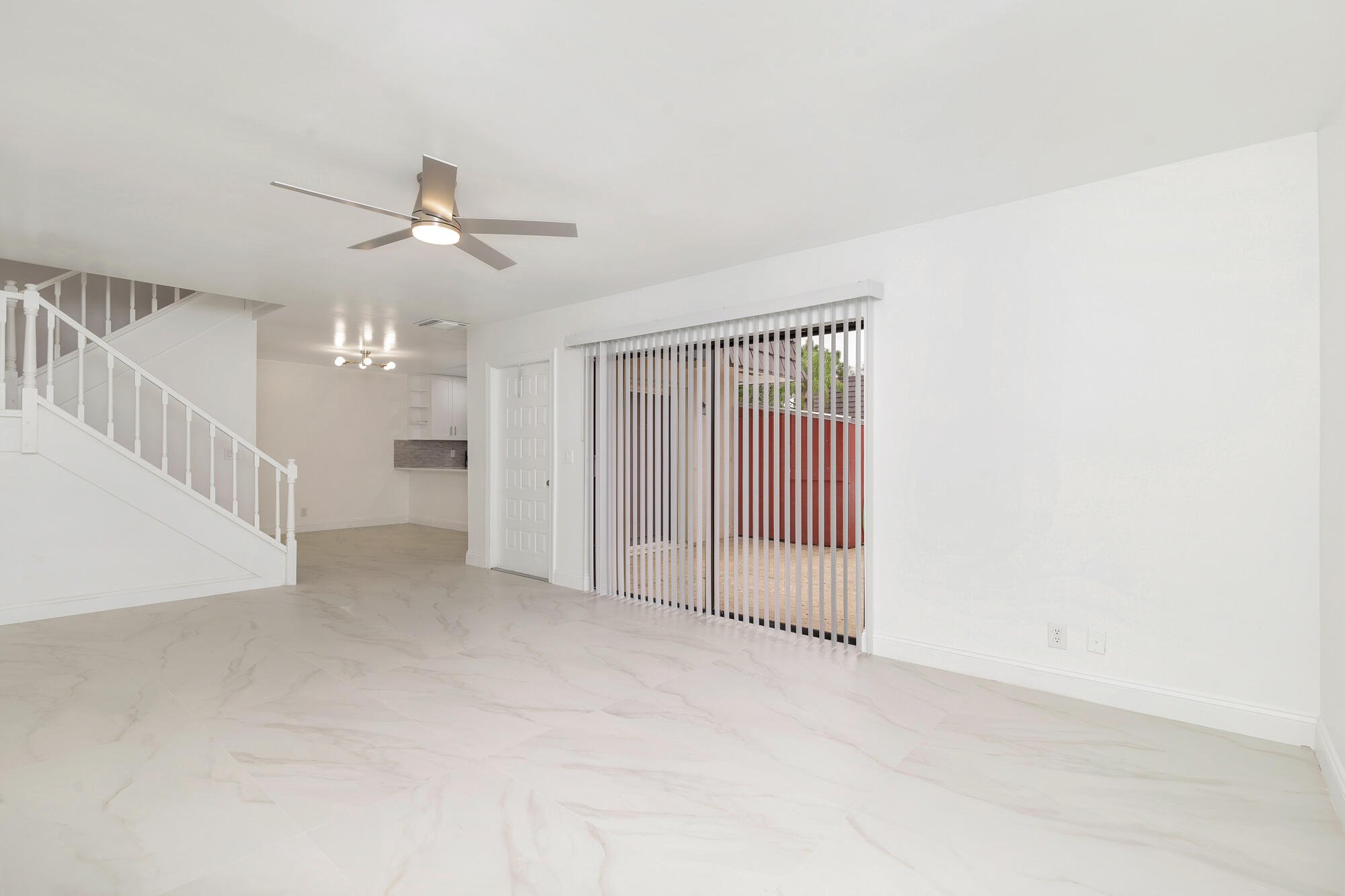 326 Jupiter Lakes Boulevard, Unit 2310B Jupiter, FL 33458 - Photo 4 of 48 a view of a livingroom with a ceiling fan