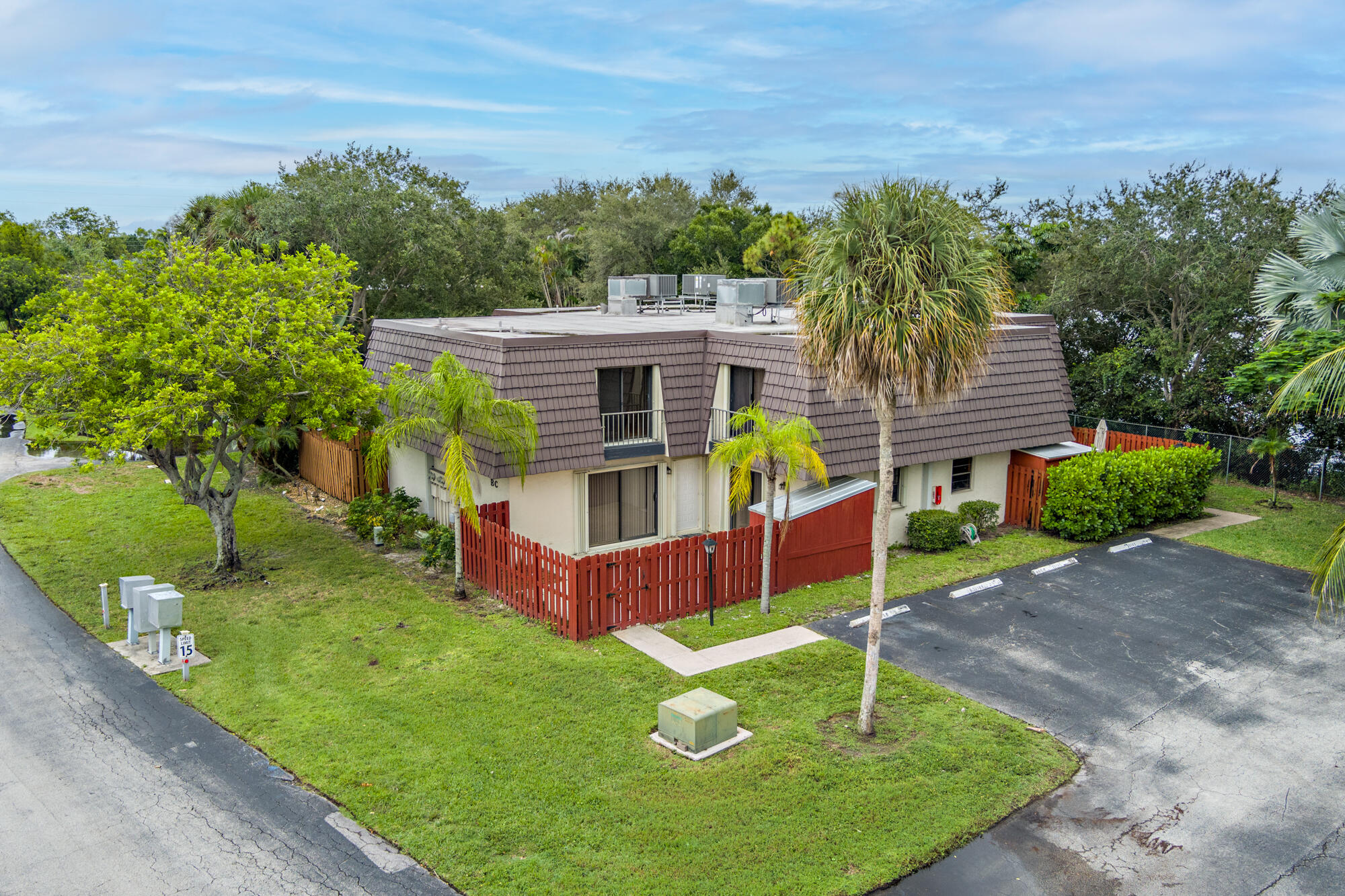 326 Jupiter Lakes Boulevard, Unit 2310B Jupiter, FL 33458 - Photo 41 of 48 a front view of a house with garden