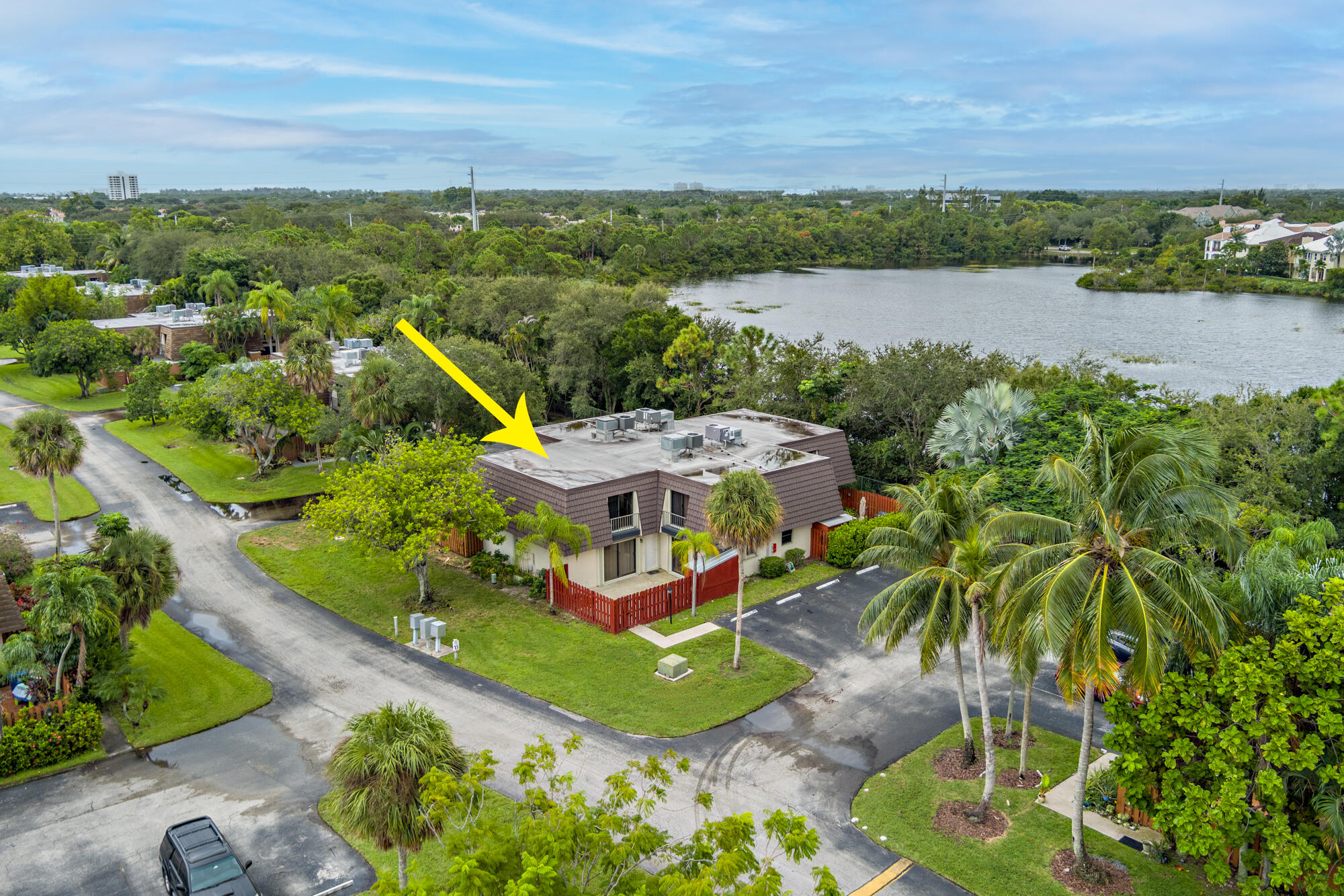 326 Jupiter Lakes Boulevard, Unit 2310B Jupiter, FL 33458 - Photo 46 of 48 an aerial view of a house with a lake view