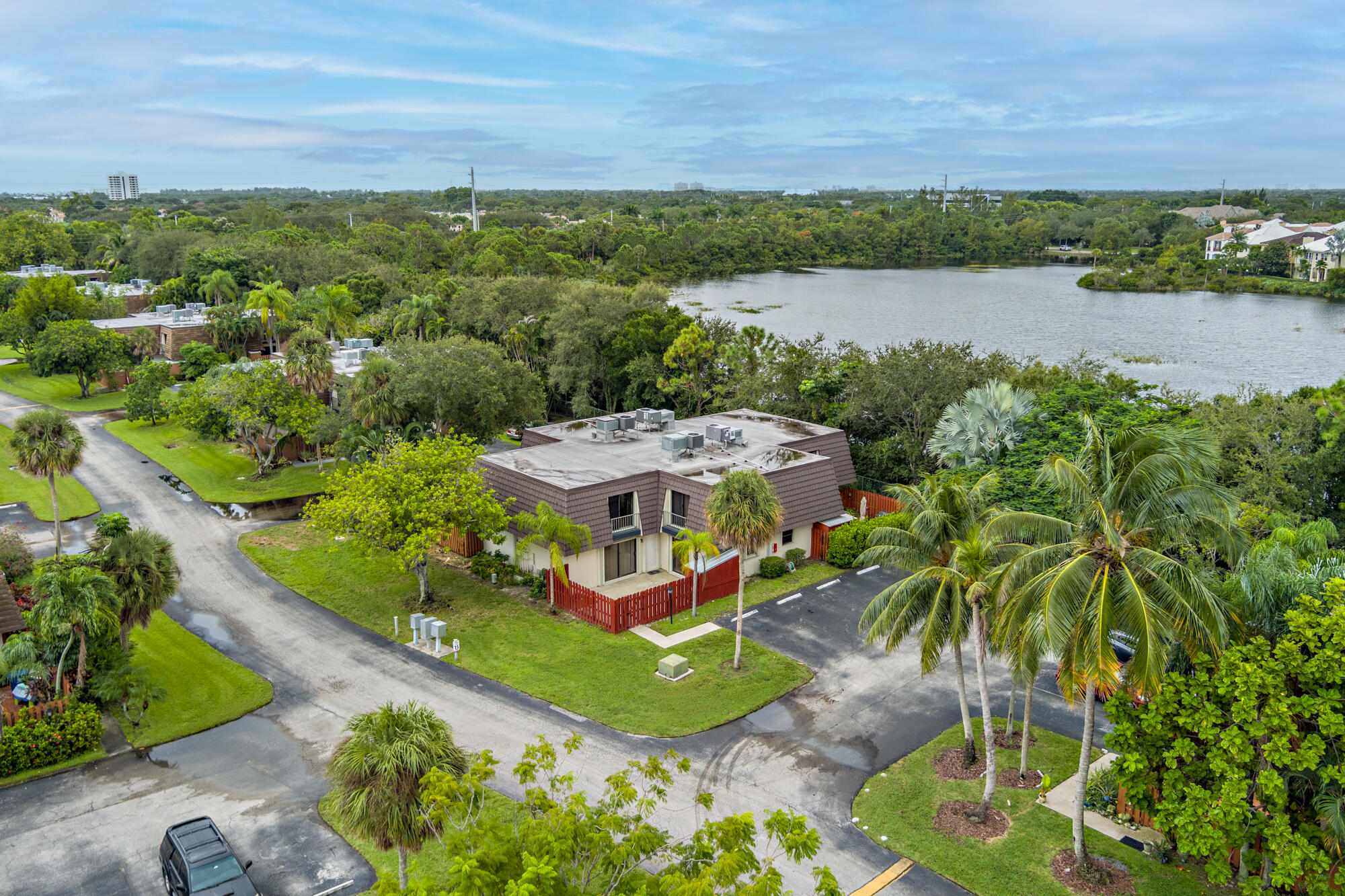 326 Jupiter Lakes Boulevard, Unit 2310B Jupiter, FL 33458 - Photo 47 of 48 an aerial view of a house with a lake view