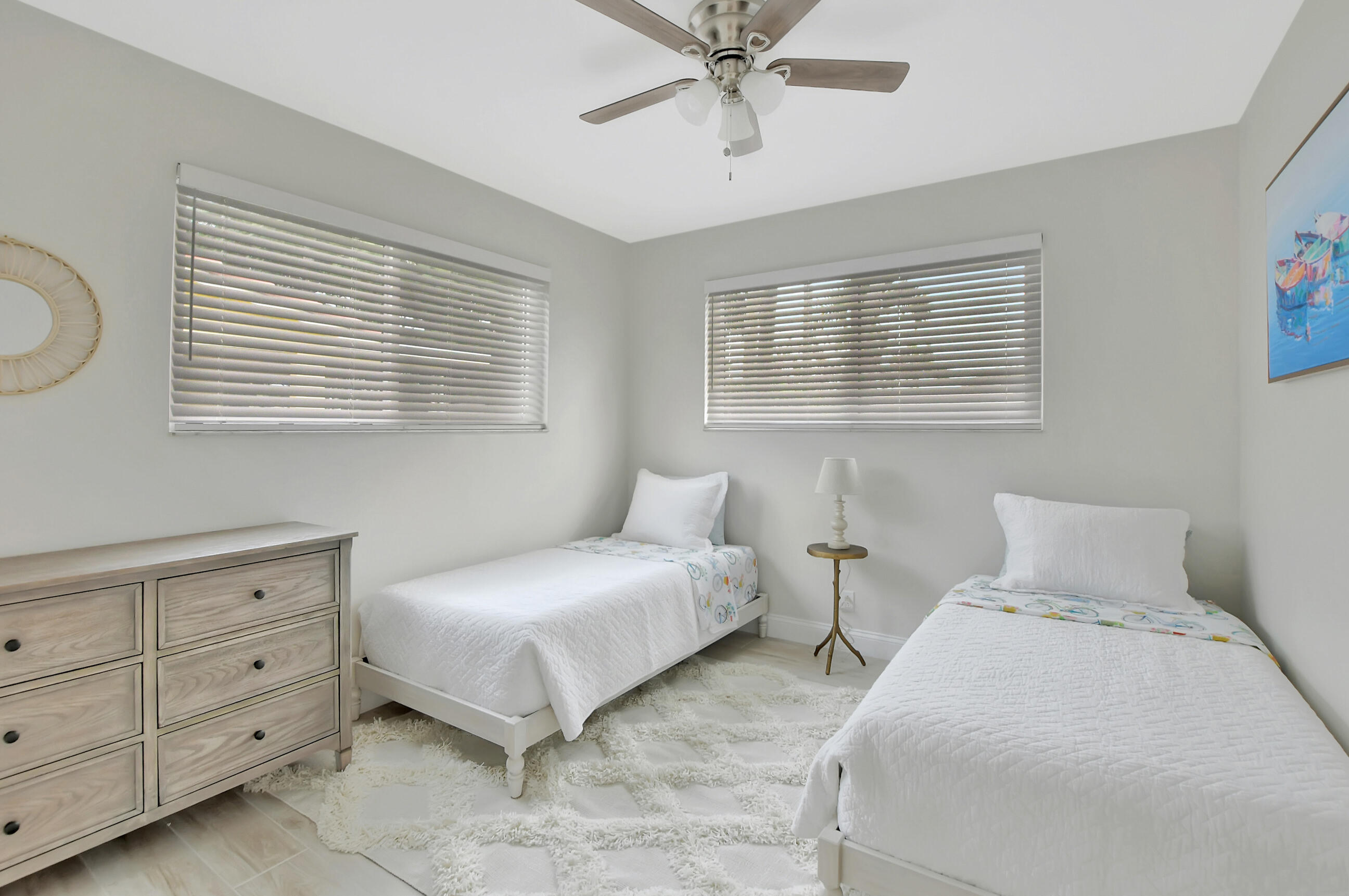 1133 Southwest 7th Street Boca Raton, FL 33486 - Photo 15 of 20 a bedroom with two beds and a dresser