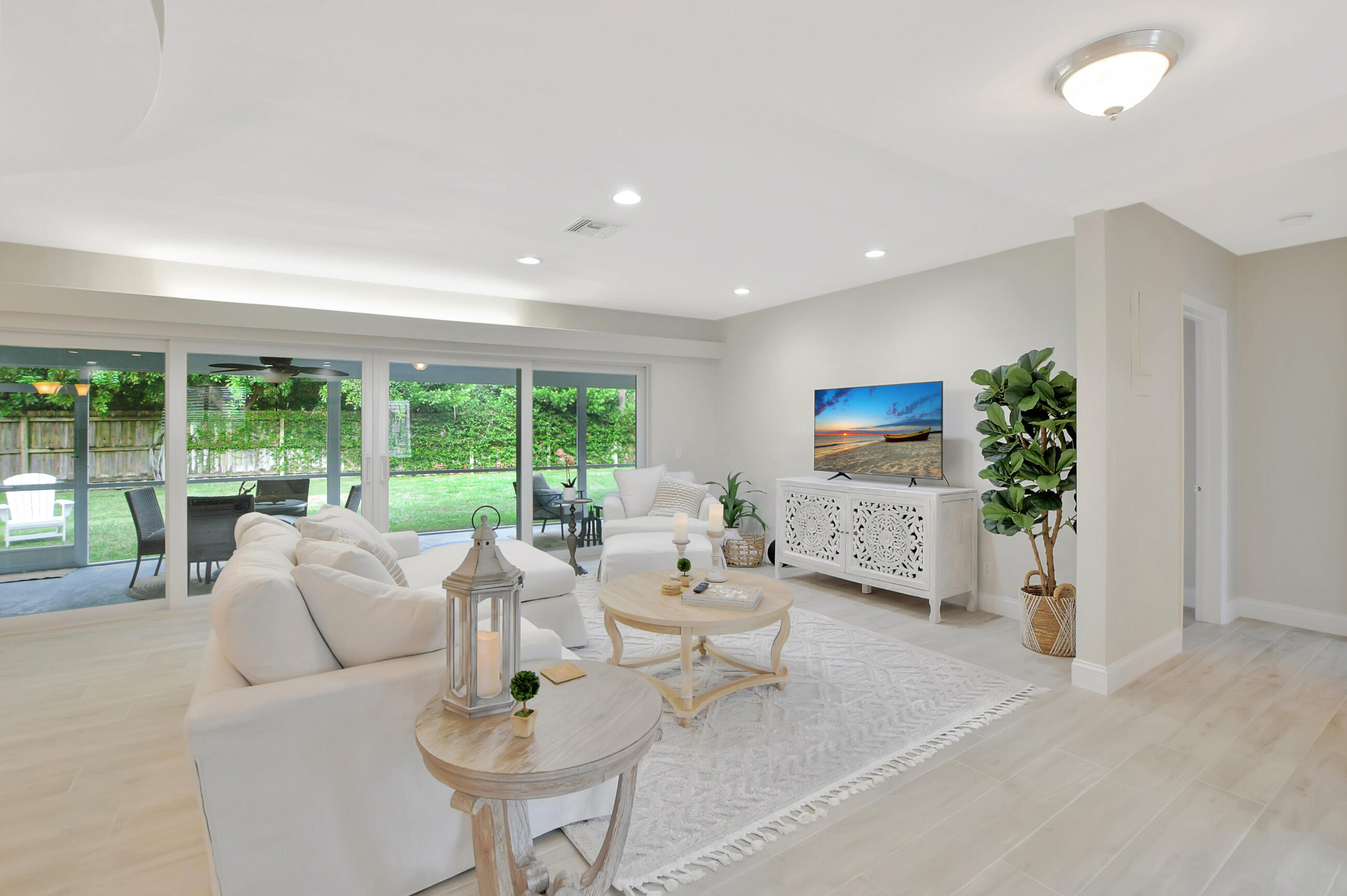 1133 Southwest 7th Street Boca Raton, FL 33486 - Photo 7 of 20 a living room with furniture and a large window