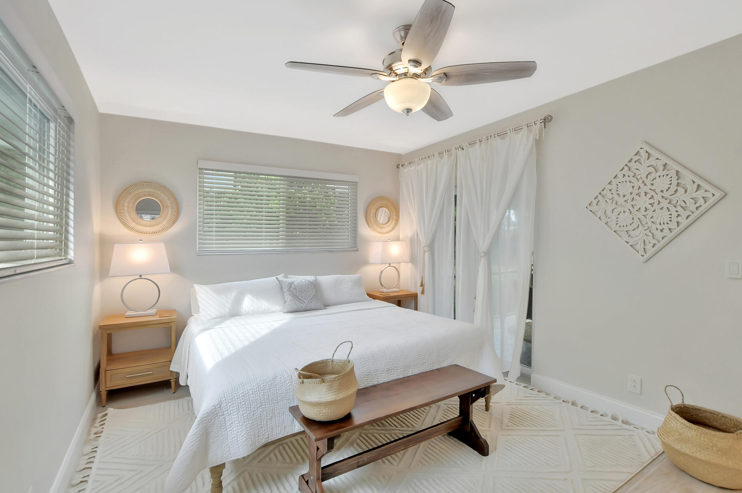 1133 Southwest 7th Street Boca Raton, FL 33486 - Photo 8 of 20 a bedroom with a bed and a chandelier