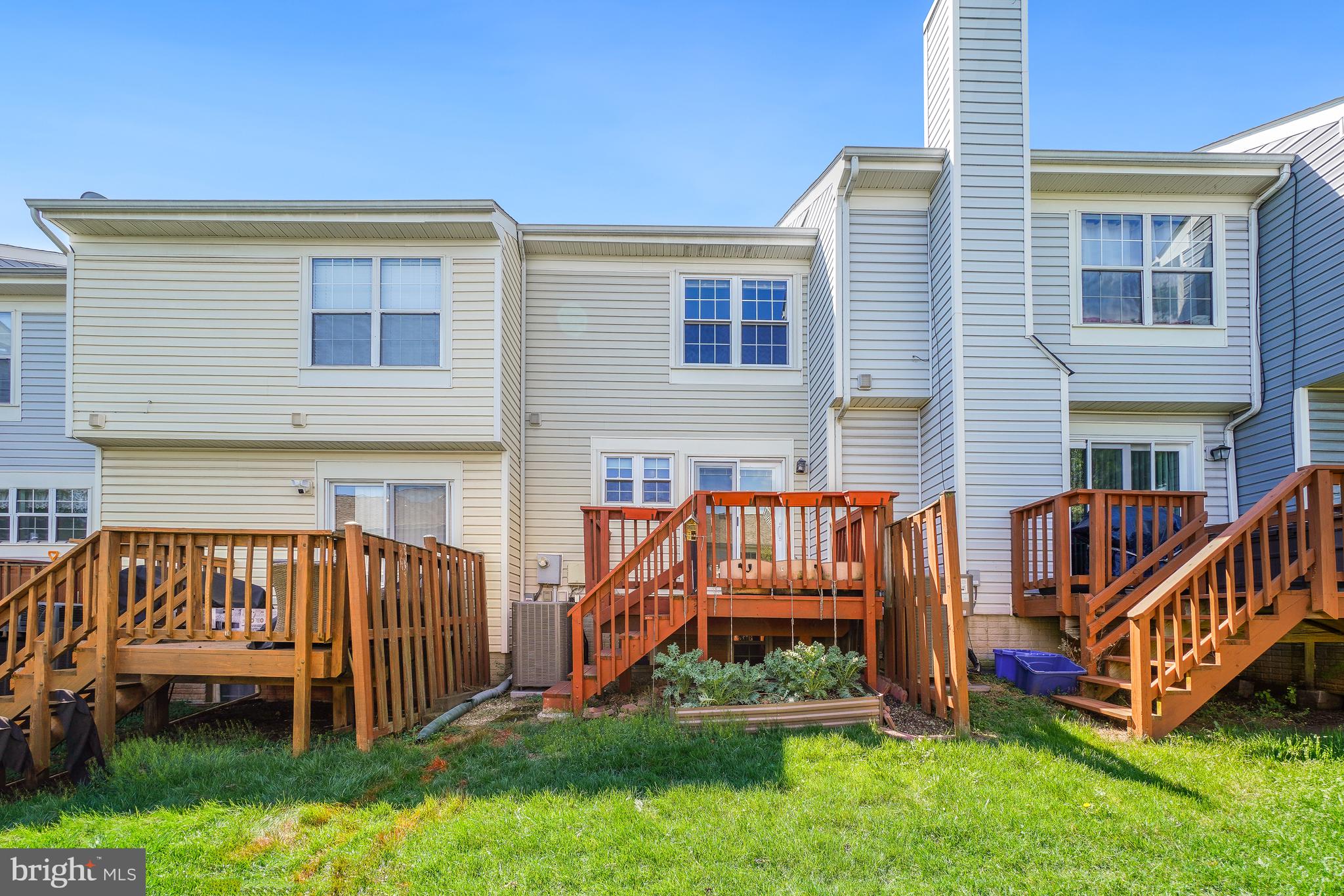 46724 Summit Terrace Sterling, VA 20164 - Photo 25 of 28 Rear Exterior open to grassy common area