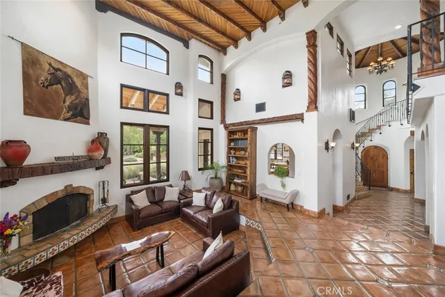 a view of living room with furniture and wooden floor