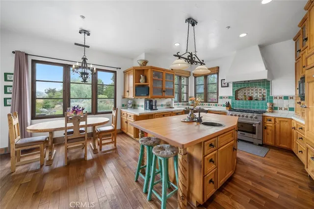 a dining room with furniture and chandelier
