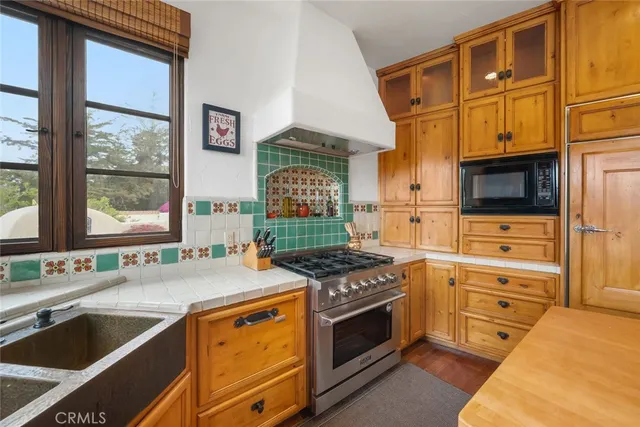 a bedroom with a bed lamp and window