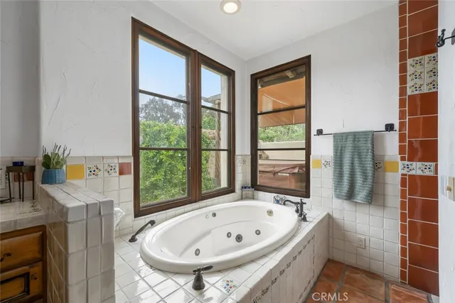 a bedroom with a large bed and a book shelf