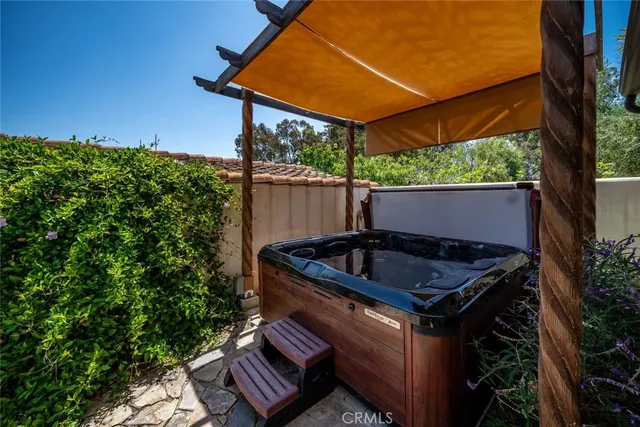 a bathroom with a granite countertop sink mirror vanity and toilet