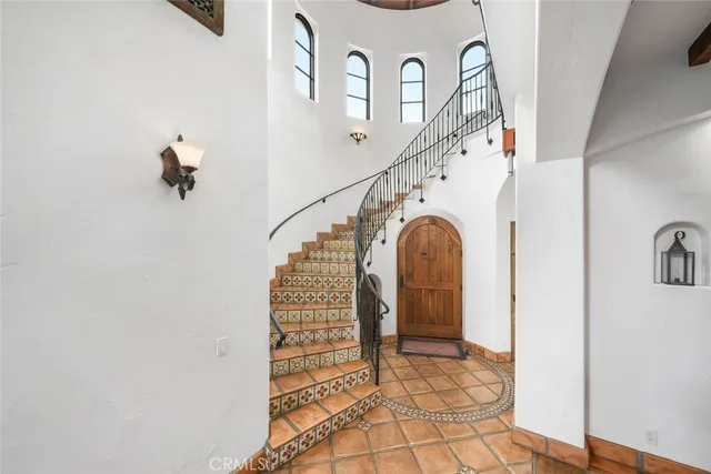 a bathroom with a sink vanity mirror and toilet