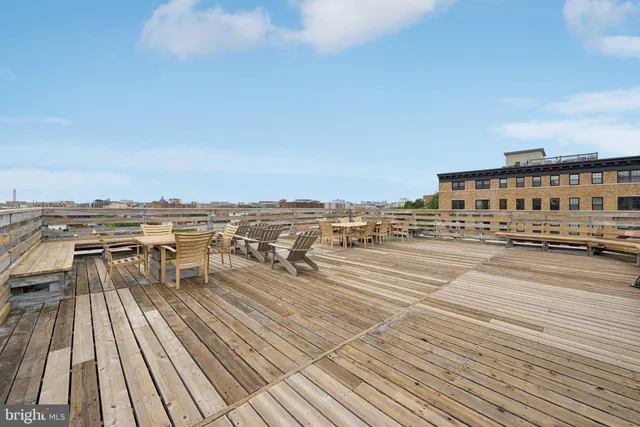 a view of a balcony with wooden floor