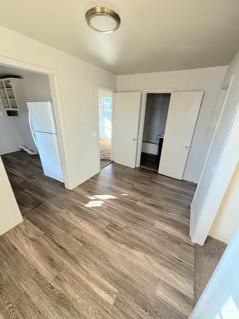 a view of a livingroom with wooden floor