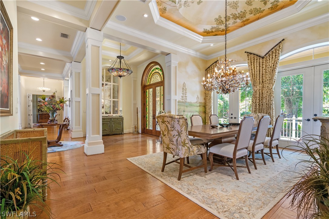 1980 Fort Denaud Road Fort Denaud, FL 33935 - Photo 13 of 35 a dining room with furniture a chandelier and wooden floor