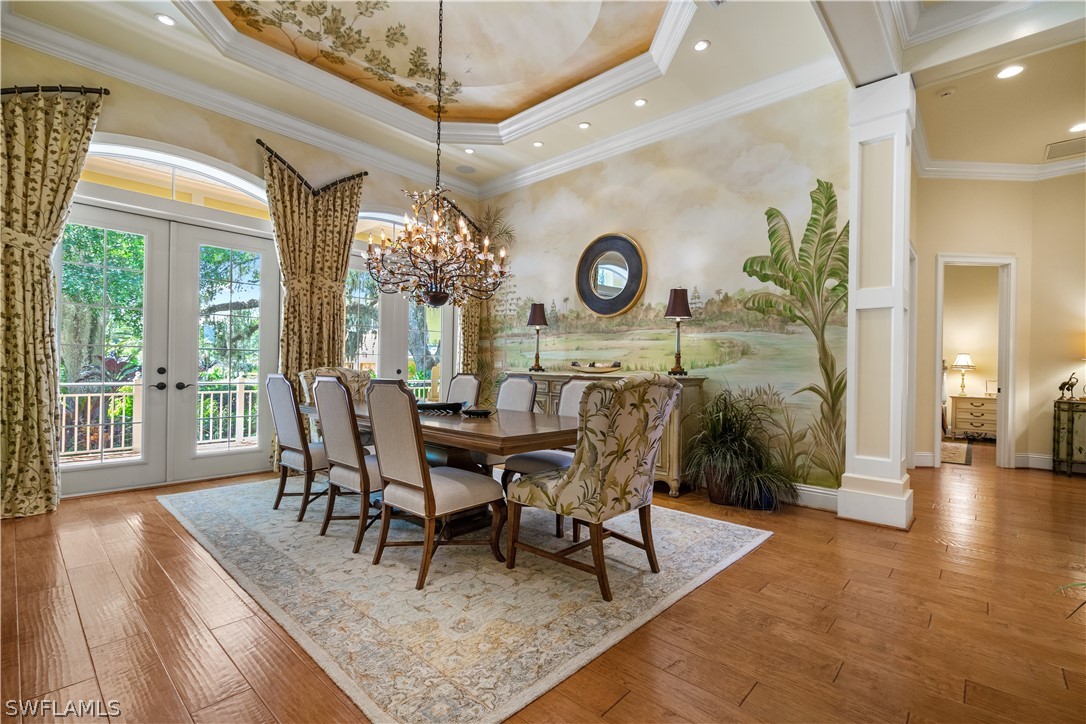 1980 Fort Denaud Road Fort Denaud, FL 33935 - Photo 14 of 35 a view of a dining room and livingroom with furniture wooden floor and a large window