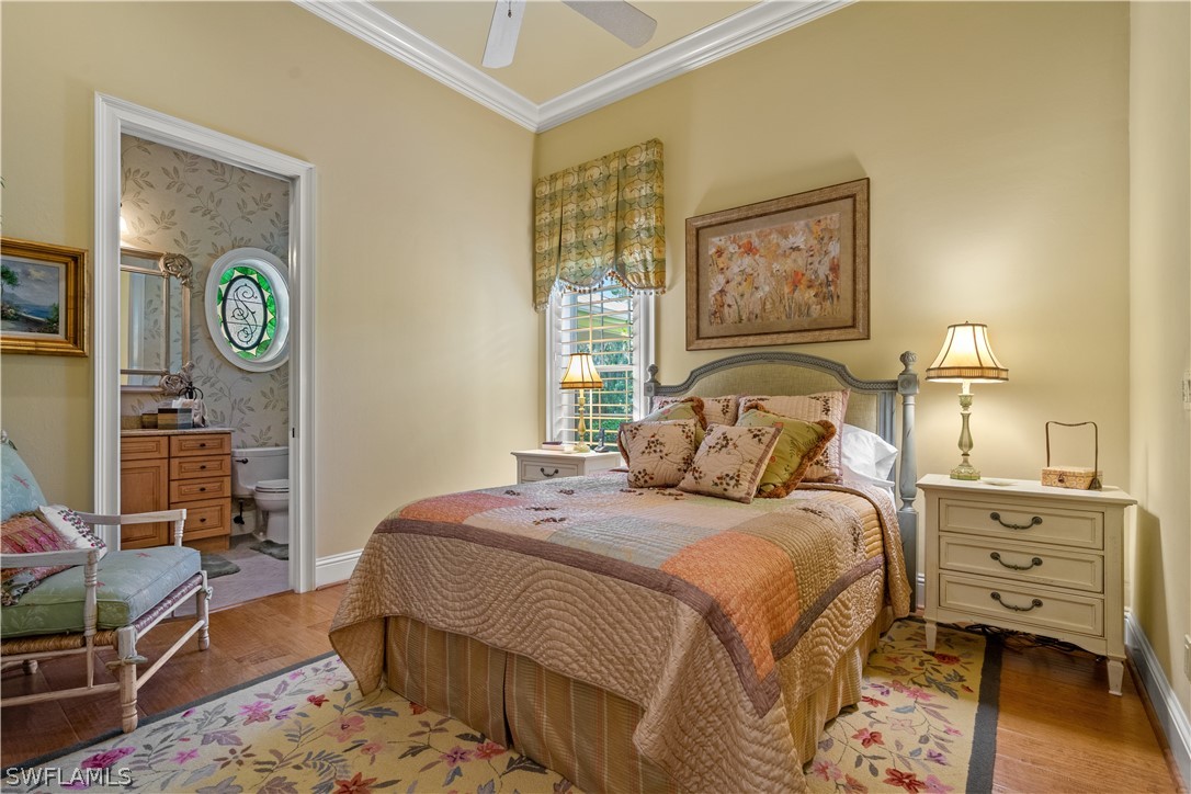 1980 Fort Denaud Road Fort Denaud, FL 33935 - Photo 15 of 35 a bedroom with a bed and wooden floor