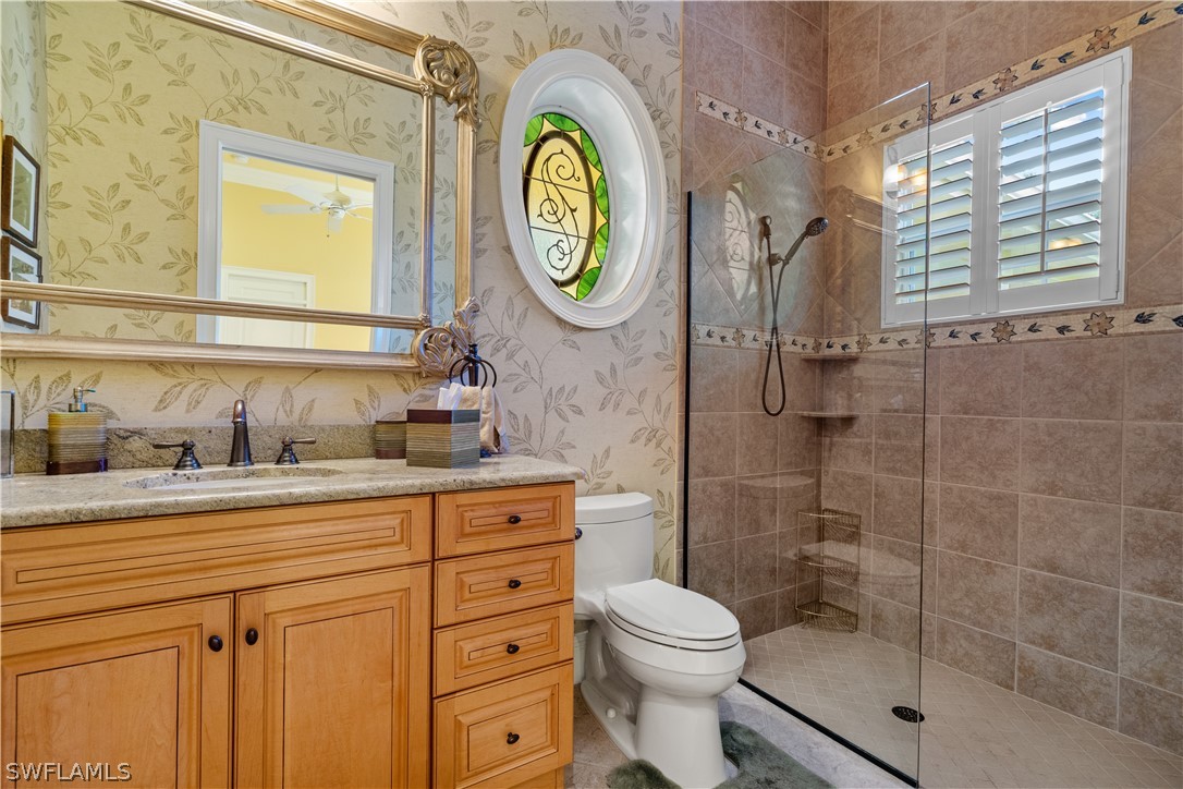 1980 Fort Denaud Road Fort Denaud, FL 33935 - Photo 16 of 35 a bathroom with a toilet a sink and a mirror