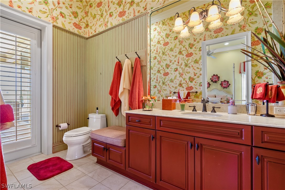 1980 Fort Denaud Road Fort Denaud, FL 33935 - Photo 18 of 35 a bathroom with a sink vanity mirror and toilet
