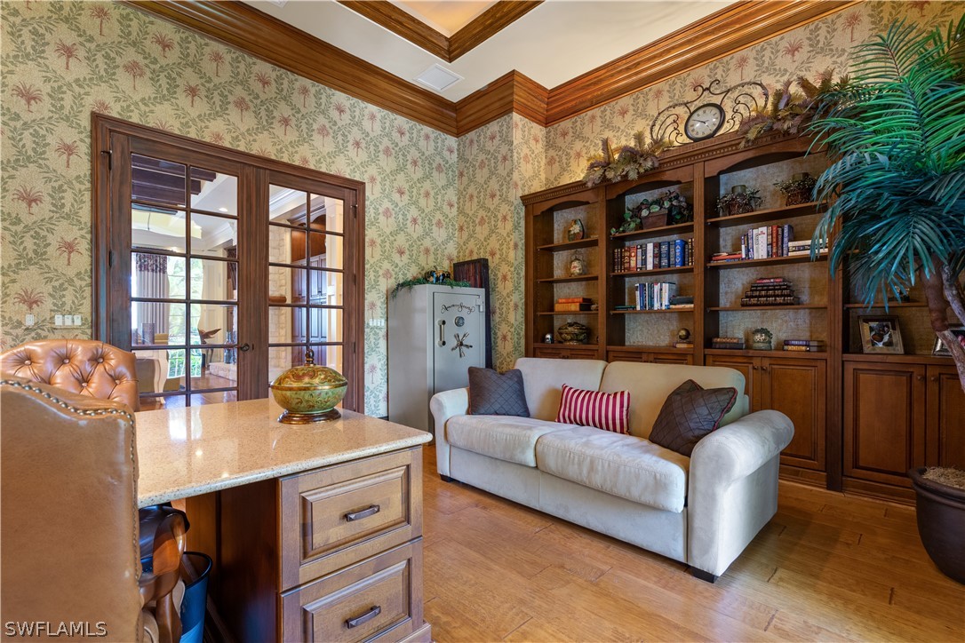 1980 Fort Denaud Road Fort Denaud, FL 33935 - Photo 19 of 35 a view of living room filled with furniture and a book shelf